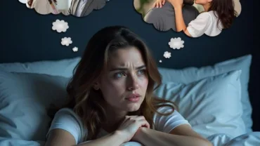 Woman looking stressed while sleeping with thoughts of her boyfriend cheating