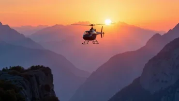 Helicopter soaring above mountain range