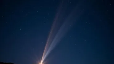 Shooting star illuminating the night sky